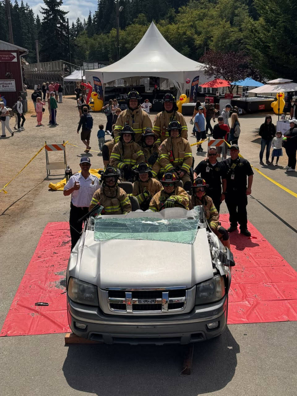 (Photo provided) South Whidbey firefighters demonstrate the different ways they can manipulate the vehicle to get patients out safely at the Whidbey Island Fair.