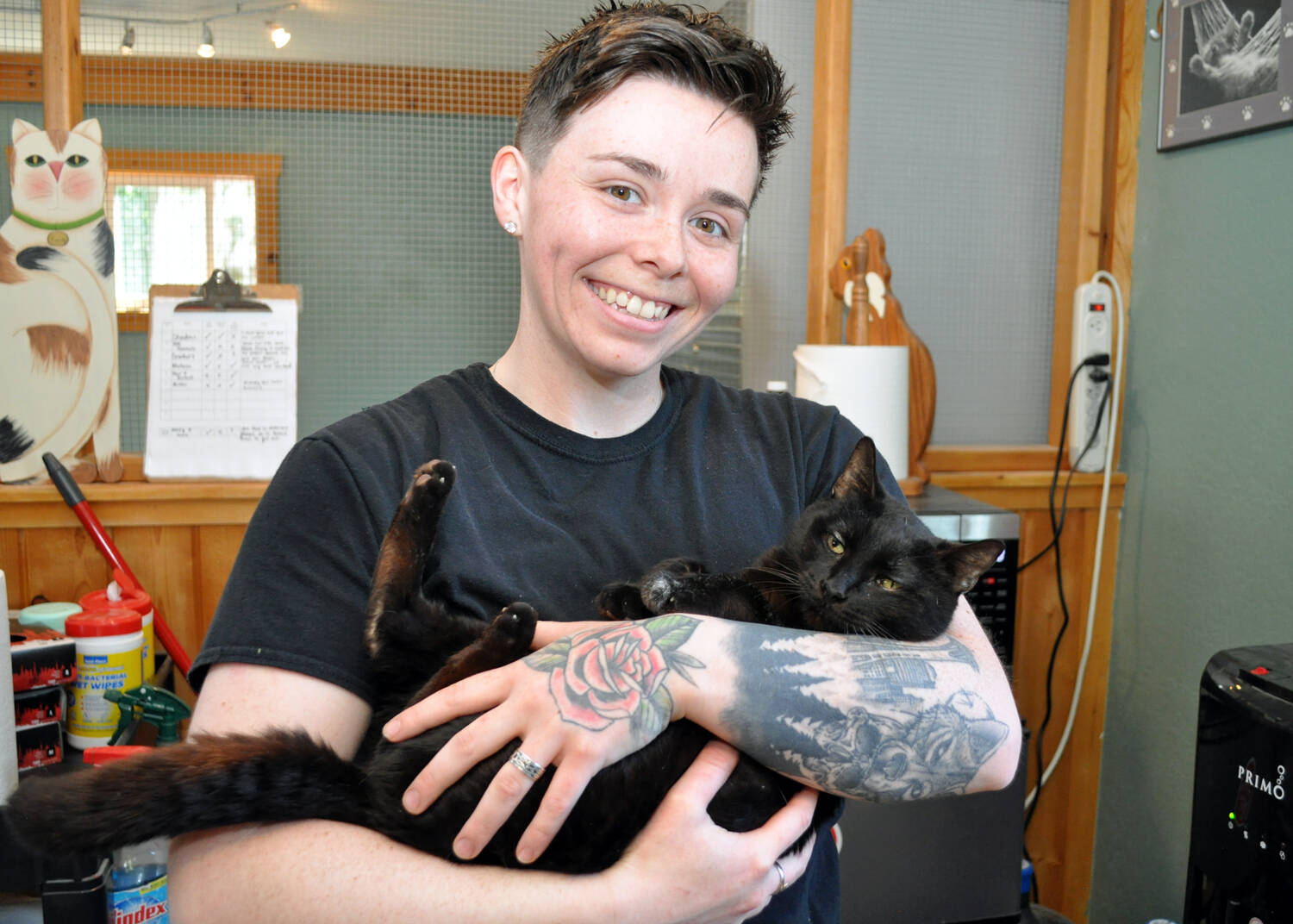 (Photo by Mary Jo Adams) Animal care technician Morgan Kenaley with Shadow at the Freeland Cat Cottage.