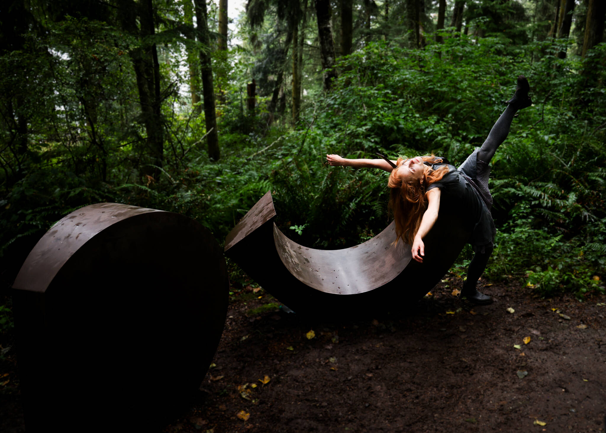 (Photo by Terrel Lefferts) Audrey Rachelle kicks her leg up in front of the display Inside Out 14 and 15.
