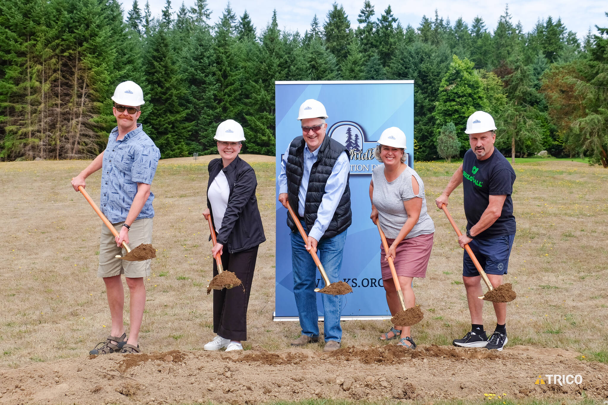 (Photo provided by South Whidbey Parks and Recreation District) South Whidbey Parks and Rec commissioners are the first to dig at a groundbreaking ceremony Aug. 18.