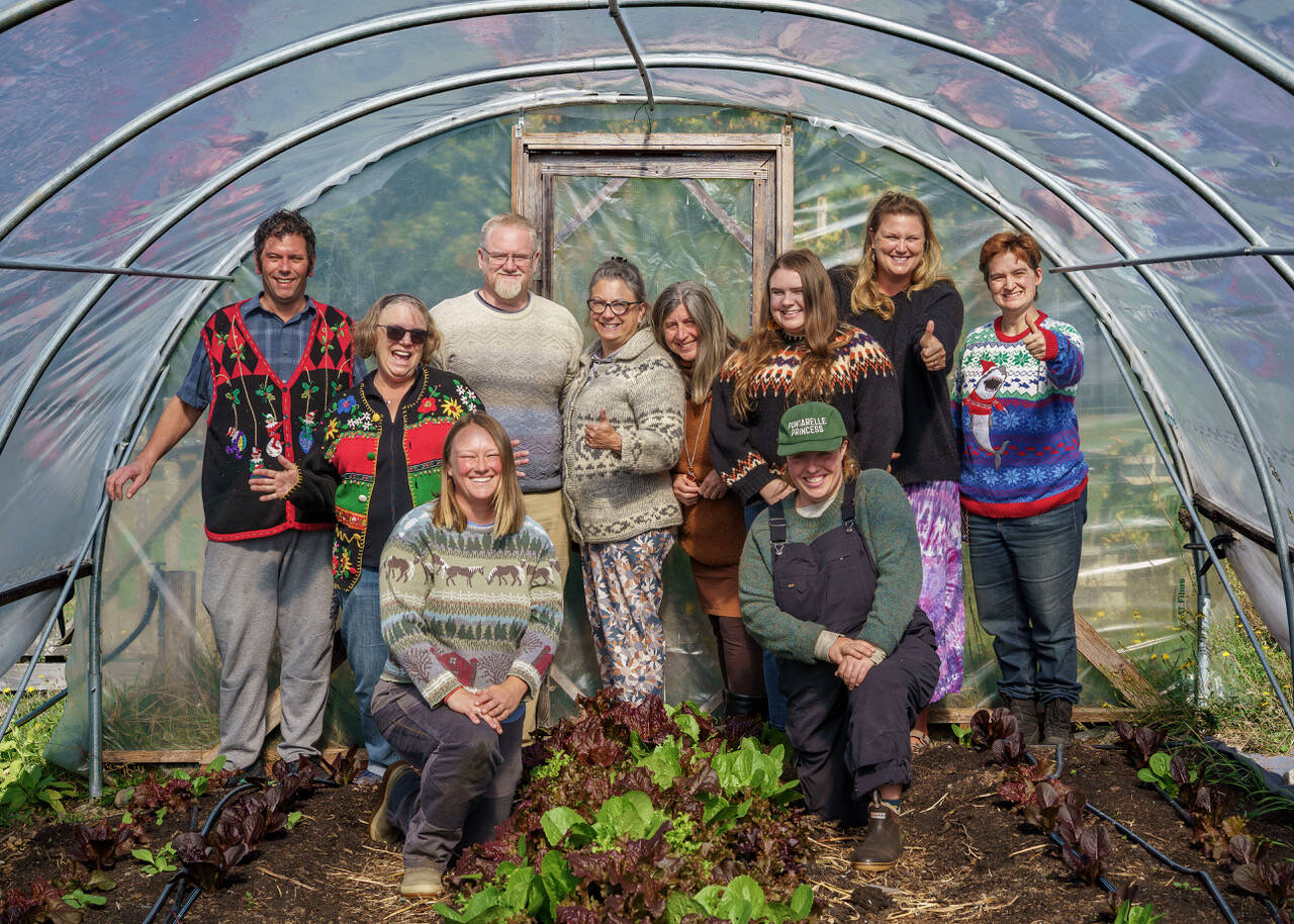 (Photo by David Welton) Good Cheer volunteers and staff members wear their favorite sweaters.