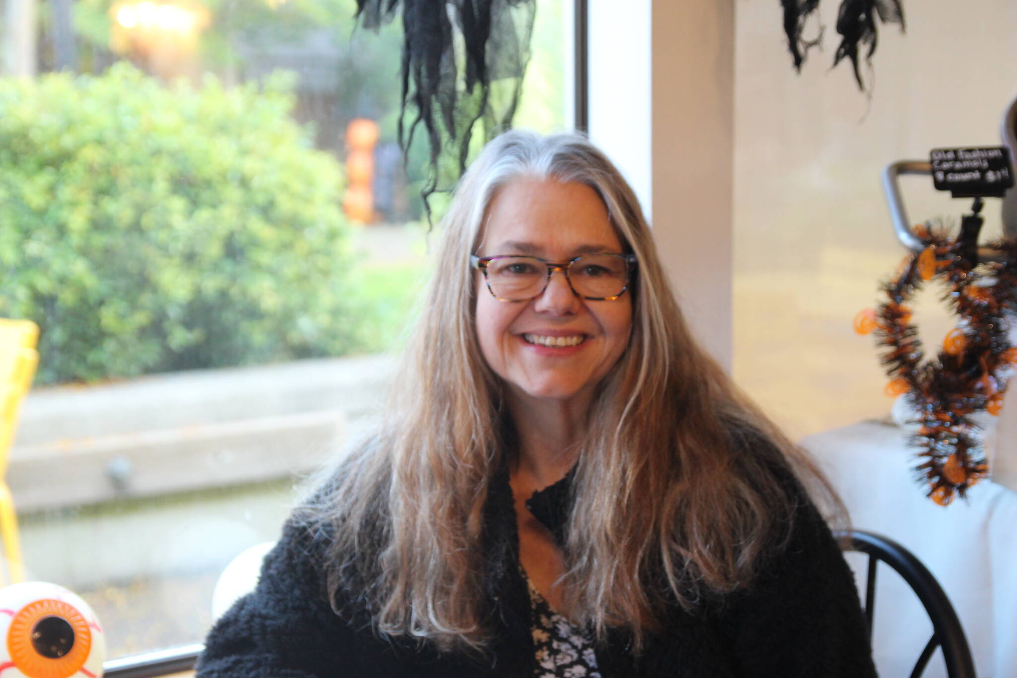 Ramona Newbauer smiles inside her store, Sweet Monas.