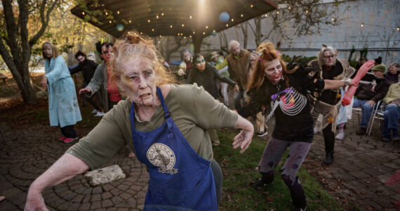 Zombies in 2023’s flash mob strike a spooky pose. (File photo by David Welton)