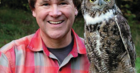 Ed Dominquez in pictured with a great horned owl