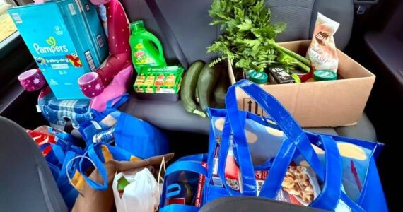 Krista Vanicsek loads her car up with produce for the food pantry. (Photo provided)