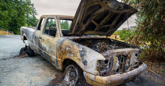 Photo by David Welton
Island County Commissioners are wondering if more can be done to reduce the cost of hauling old and abandoned vehicles, such as this one that suffered catastrophic damage from a fire.