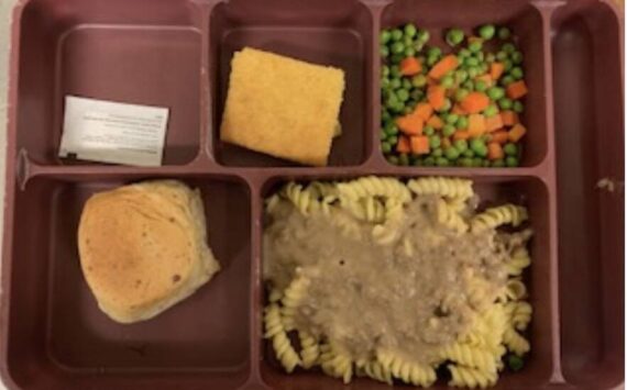 A meal tray from Island County Jail has beef gravy over noodles with mixed vegetable, corn bread and garlic roll.