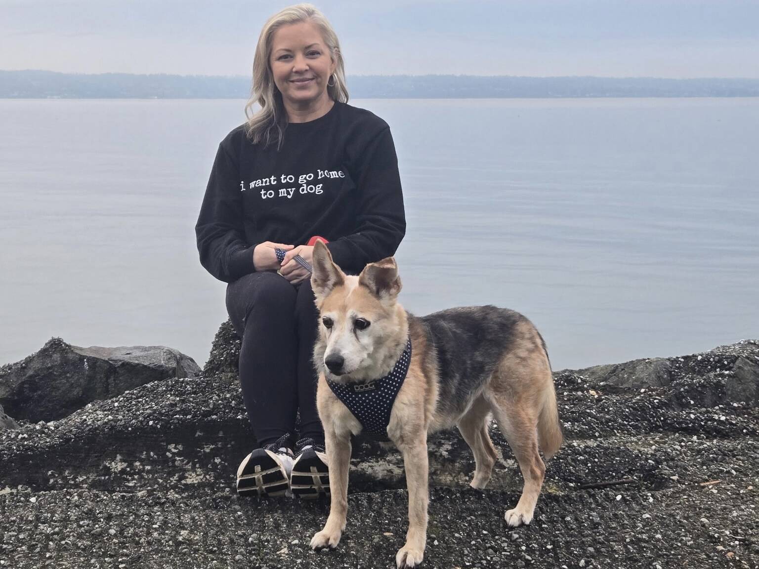 Sommer Bowlin poses with her 15-year-old rescue dog, Tika. Bowlin, a Clinton resident, is the admin for Bring Em Home Whidbey, a volunteer-run Facebook group that helps reunite lost pets with their owners across Whidbey Island.