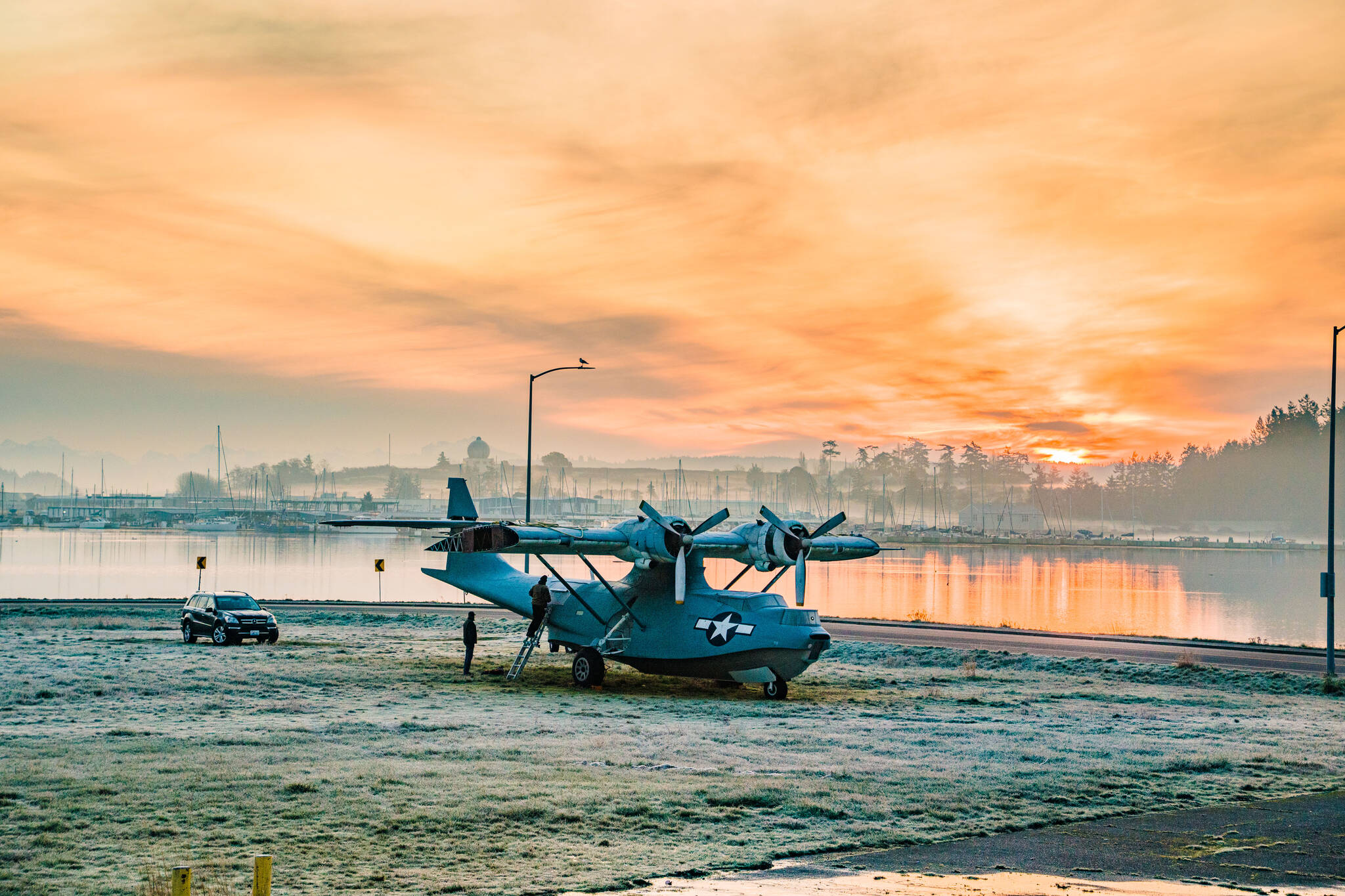 (Photo by David Welton) A PBY Catalina, owned by the Pacific Northwest Naval Air Museum, sits in downtown Oak Harbor, awaiting a flight to its new home.