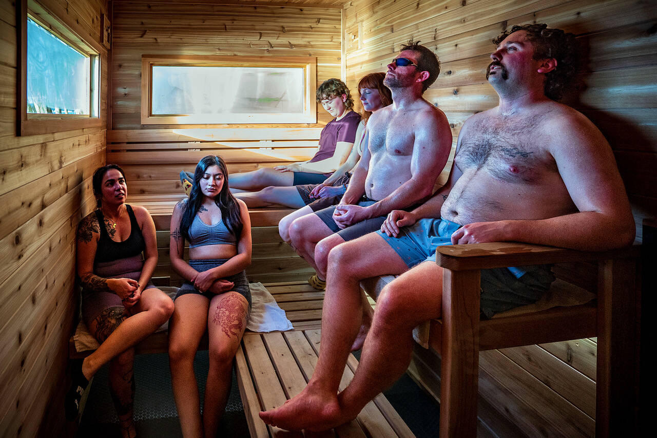 (Photo by David Welton) From left, Jaqueline Morales, Lupita Morales, Peyten Tucker, Maia Rezoski, Evan Bishop and Ryan Tucker enjoy a communal and contemplative moment in the mobile sauna.