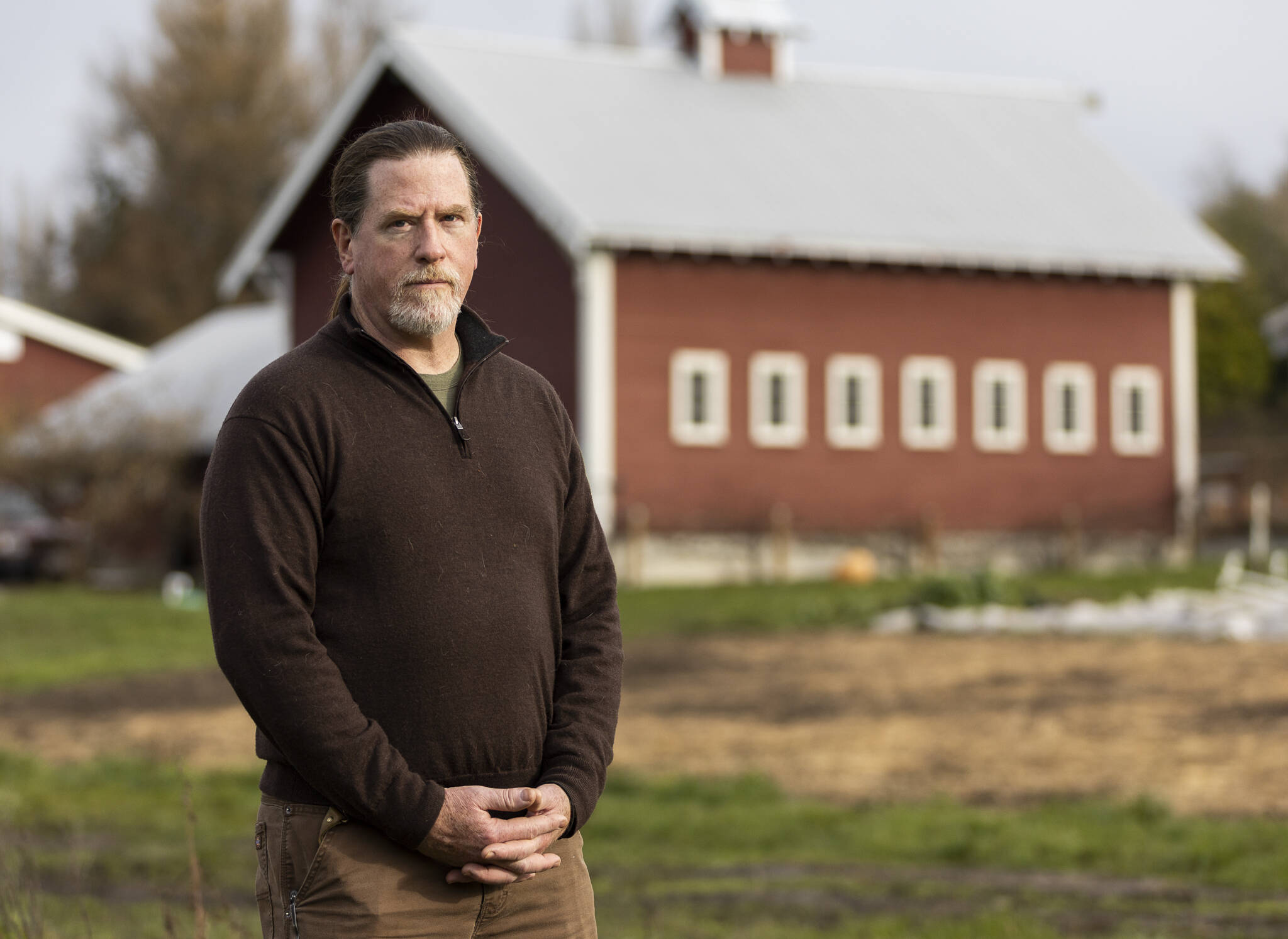 Vincent Nattress, the owner of Orchard Kitchen, at his adjacent farm on Monday, Jan. 26, 2026 in Langley, Washington. (Olivia Vanni / The Herald)