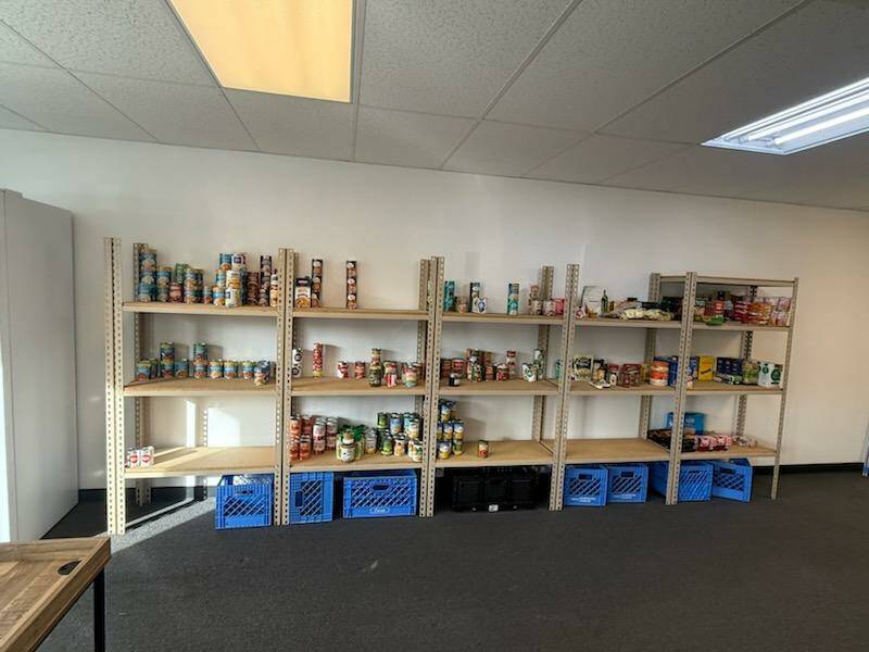 (Photo provided by Tanya Hernandez-Garzon) The shelves of food in the new Queen-Bee Pantry.