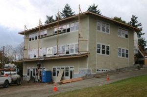 Work continued Monday on this new office-retail building near the PayLess Shopping Center in Freeland.