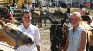Emily Houck and Molly Rawls pose with their friends Becca and Rhia on the last day of the Island County Fair. Both will participate in today’s O-Mok-See event