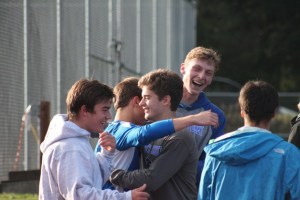 The South Whidbey cross country boys team celebrates after learning of qualifying for the state 1A meet Nov. 8.