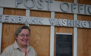 Retiring postmaster Roxy Etherton stands in front of the place she loves.