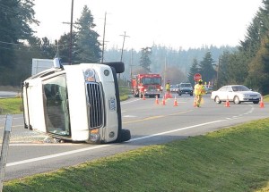 A Chrysler Aspen came to rest on its passenger side after colliding with a Toyota Camry on Monday afternoon at Highway 525 near the Texaco gas station.