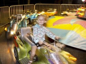 Kadynce Hines enjoys her cycle ride at the Island County Fair.