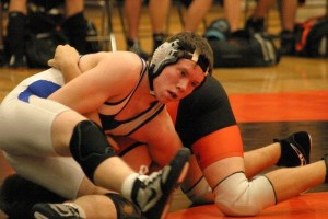 Jeremiah Robey works to pin Granite Falls grappler Gerin Wilson in the 171 weight division on Thursday. Robey won the match 9-7 in three rounds and almost pinned Wilson in the second period.
