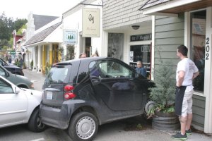 This Smart car rests against the exterior wall of Ott & Murphy on First Street in Langley. The driver