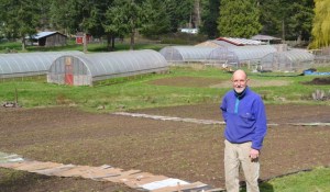 Bill McInvaille stands in front of his nearly 3 acre farm