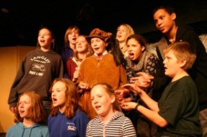 The chorus belts with the best of them in the Whidbey Children’s Theater production of  “Cinderella.” Fom left are Emma Lungren