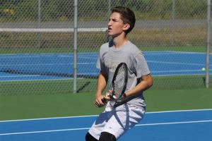 Falcon junior Ryan Wenzek readies himself for an incoming volley during practice.