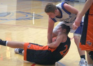 Sam Turpin fights Granite Falls sophomore Dan Matalomani for the loose ball Friday night. The possession arrow sent the ball to South Whidbey in the second quarter.
