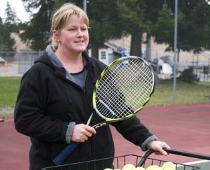Karyle Kramer instructs the Falcon tennis team on her second day as the girls tennis coach. She was hired after her father resigned.