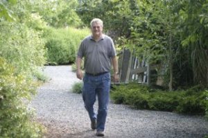 Jim Tompkins stretches his legs at Bayview Corner. Tompkins joins 400 others this weekend for the Whidbey Walking Festival in Coupeville.