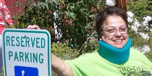 Victory Lee Schouten wears a neck brace after undergoing a complex spinal surgery.