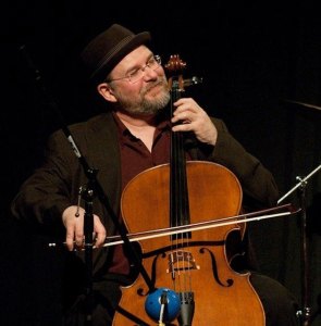 James Hinkley basks in the glow of his cello onstage.
