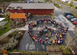Participants gather for the annual peace sign photo
