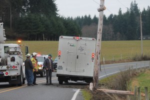 A power pole on Ewing Road was snapped in half Tuesday after it was hit by a delivery truck.