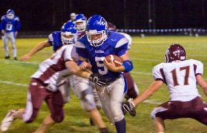 Falcons running back Henry Mead cuts through the Lakeside line during South Whidbey's first conference win on Friday.