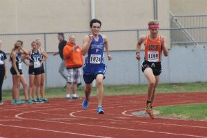 Senior Falcon cross country runner Evan Mellish sprints the final stretch  of the South Whidbey Invitational on Saturday.