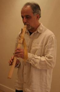 Native American flute player Joe Arnold takes a musical break at the Bayview Cash Store recently to serenade local shoppers.