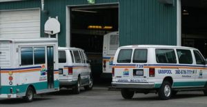 Two Island Transit vehicles await servicing in the system's only two maintenance bays in Coupeville. Island Transit is asking voters to approve an increase to the retail sales tax on Aug. 18