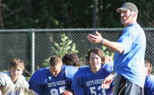 Falcon coach Andy Davis talks to his players after the close of a practice  session last week. The Falcons were set to start the season on Friday against Bellingham.