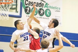 Falcon forwards Nick French and Zach Comfort smother Knights senior forward Christian Taylor as he drives for a layup. Taylor scored 18 points to beat the Falcons.