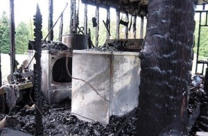 The charred dryer at left is blamed for starting a fire in Freeland on Saturday morning that destroyed this mobile home and killed a number of pets. The home’s occupant escaped uninjured.