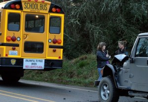 These women discuss the rear-end crash of the Jeep and the school bus Thursday afternoon.