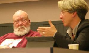 School Board Member Fred O'Neal listens as District Superintendent Jo Moccia talks about the latest enrollment figures at Wednesday's school board meeting.