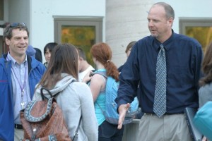 Scott Mauk and John Patton greet and usher students into South Whidbey High School during the first week of classes. Both are new to their positions as assistant principal and principal