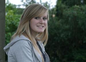 Falcon cheerleading captain Brandi Winn takes a break before a South Whidbey girls basketball game last week.