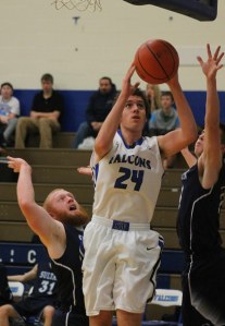 Falcon sophomore Max Friedman jumps between Sultan’s Ronnie Skorska and Kolton Anderson for a layup attempt Wednesday night.