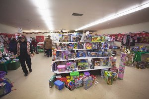 Volunteers stock the Holiday House