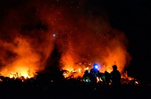 South Whidbey Fire/EMS firefighters rally at a barn fire in Clinton Monday night. The structure and all its contents were destroyed.