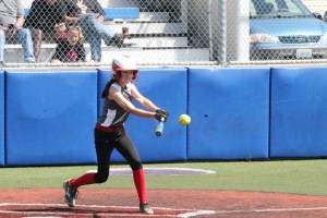 Whidbey’s Scout Smith swings during the team’s 18-3 win over South Skagit Saturday. The sluggers ended their season Tuesday in a loss to Anacortes in the District 11 championship game Tuesday. Smith had seven strikeouts pitching during the game and on offense she had a single and RBI.