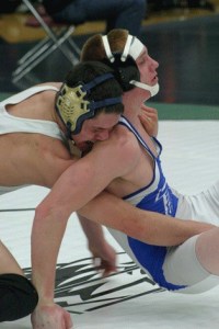 Montana Johnson tries to break free from Everett senior Taylor Starr’s grip during the first round 160-pound match.